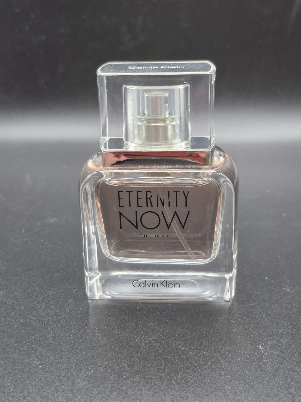 Calvin Klein Eternity Now for Men - Clear Glass Bottle with Pale Amber Liquid